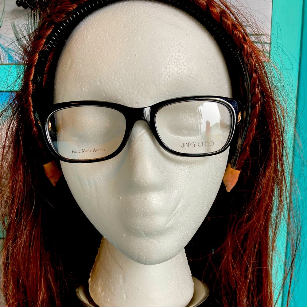 Jimmy Choo Eye glasses frames never used. Black with spring hinges w/ gold trim